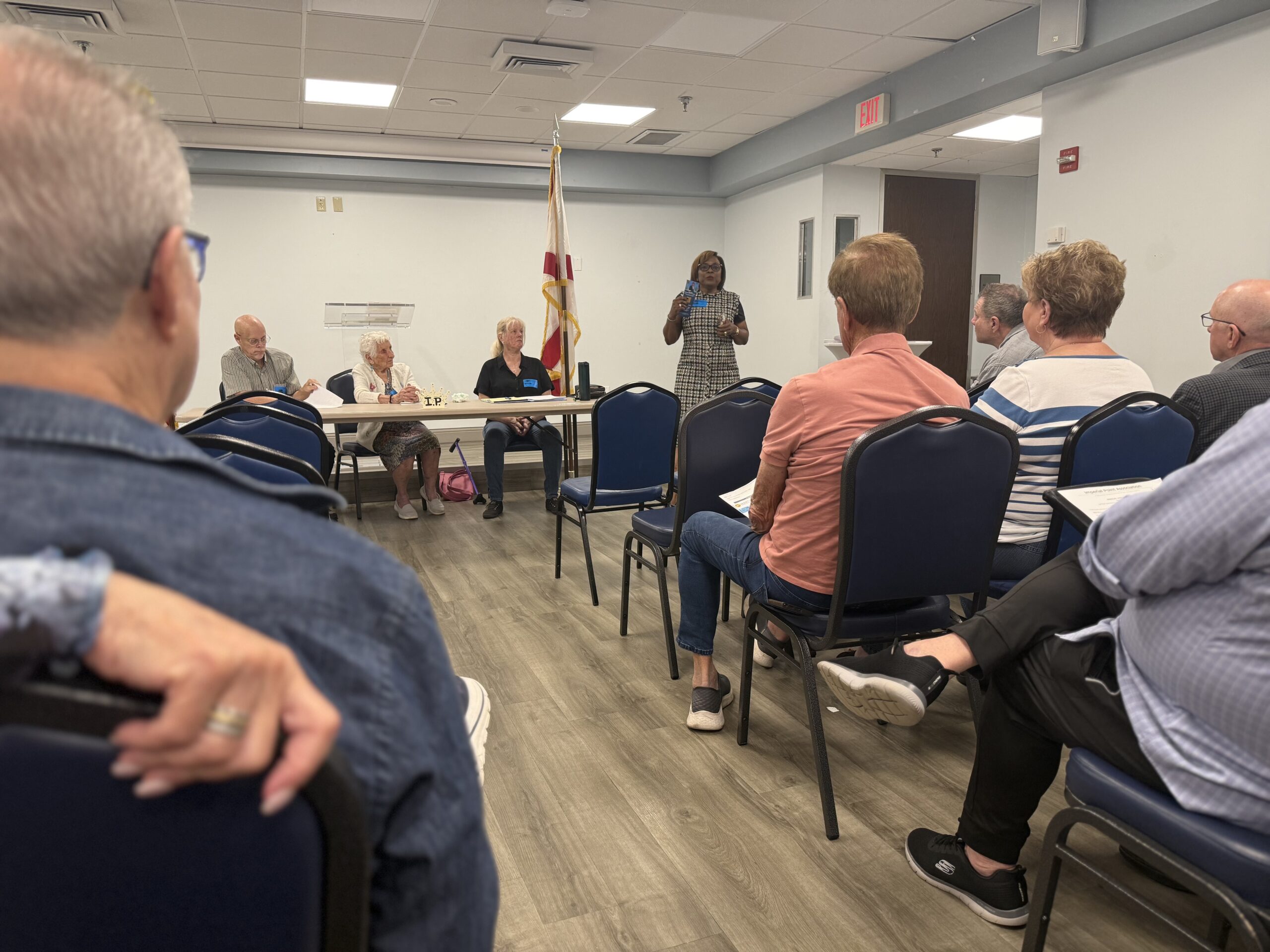 Broward County Tax Collector Abbey Ajayi speaks to residents during an Imperial Point Association community meeting.