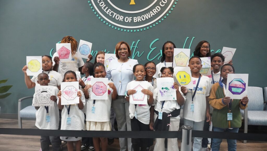Broward County Tax Collector Abbey Ajayi with Junior Tax Collectors during take your child to work day.